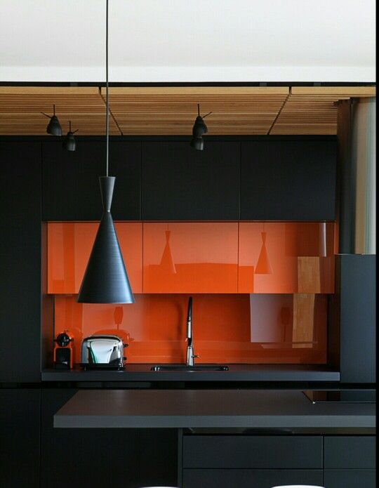 02-a-minimalist-kitchen-in-black-and-orange-