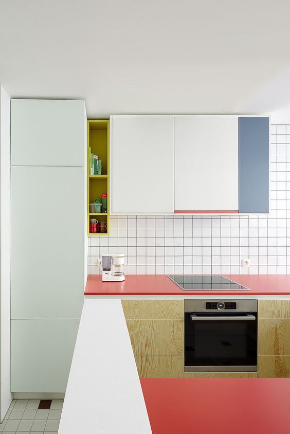 03-a-minimalist-color-block-kitchen-with-coral-aqua-and-blue-accents